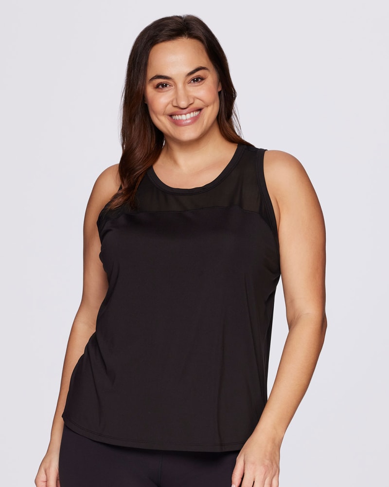 Front of a model wearing a size 3X Plus Super Soft Easy Breezy Tank in Black by RBX Active. | dia_product_style_image_id:294870